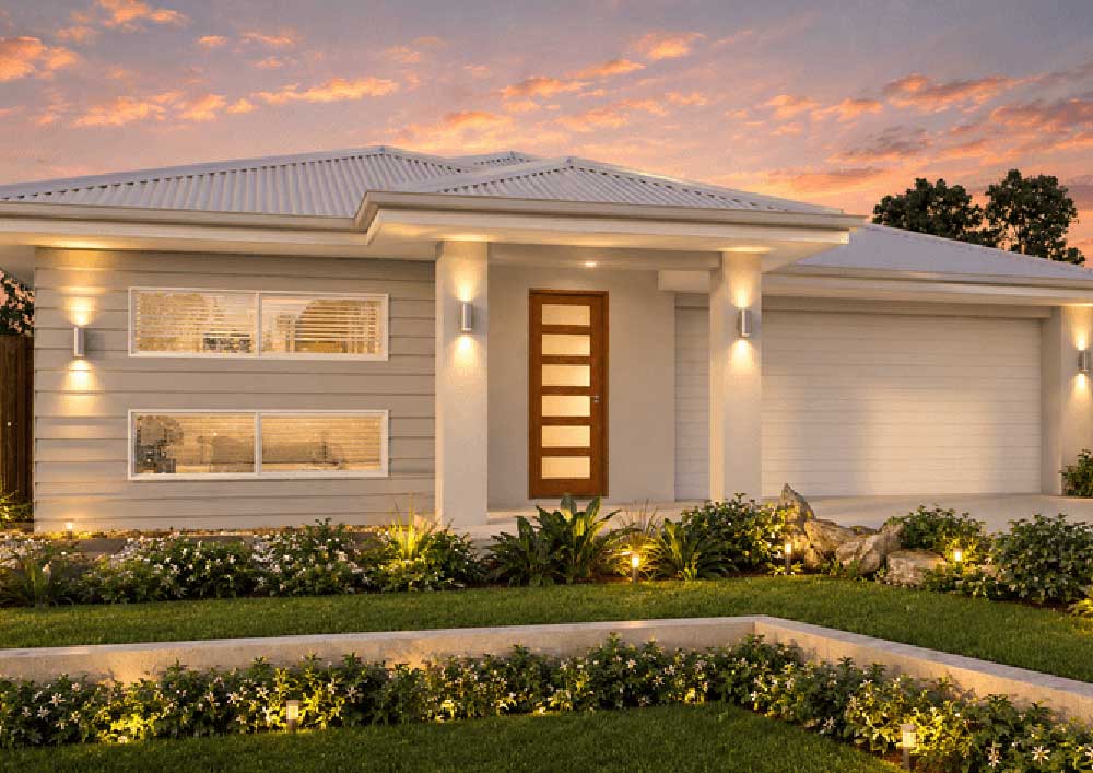 183-Plumbago-Dakota - Fresh Homes Modern single-story home with a wooden front door, warm entrance lighting, and a manicured front garden at sunset.