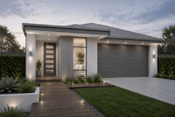 Modern single-story home with a two-car garage, illuminated entry, and wooden walkway at dusk.