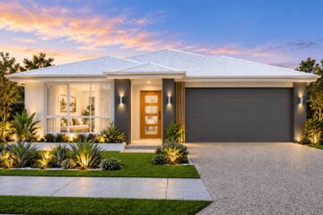 Single-story modern house with a white roof, wooden front door, and a two-car gray garage, illuminated landscaping at dusk.