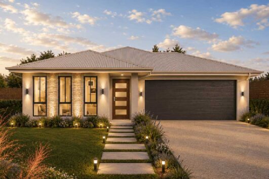 Modern single-story home with a two-car garage, illuminated entry, and a stone walkway leading to the front door.