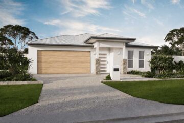 Modern single-story home with a wide two-car garage, white facade, stone accents, and manicured front yard.