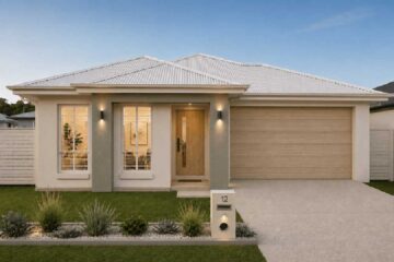 Modern single-story home with a double-car garage, light exterior and a manicured front yard at dusk.